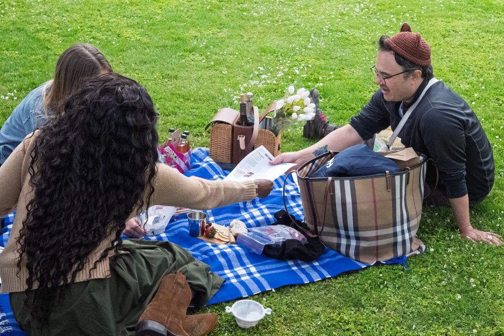 Sage giving out Cozy Cubs puzzles in Golden Gate Park