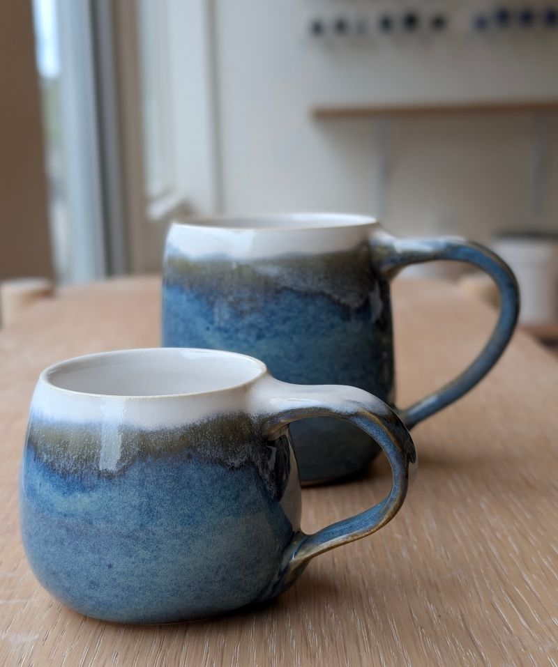 Two Horizon mugs that I made at Wheelhouse Clay